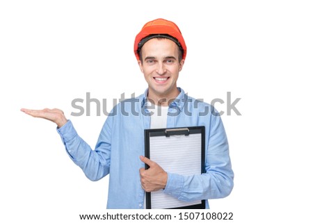 Builder in helmet, man shows empty space, isolated background, copy space
