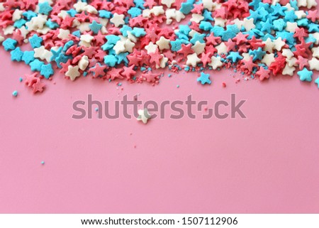 Sugar topping for cake, frame on a pink background, free space for text.