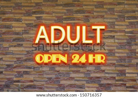 Adult neon sign with 24 hr open signage.