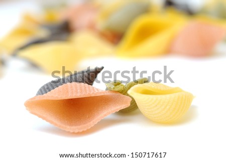 Conchiglie pasta on white background 