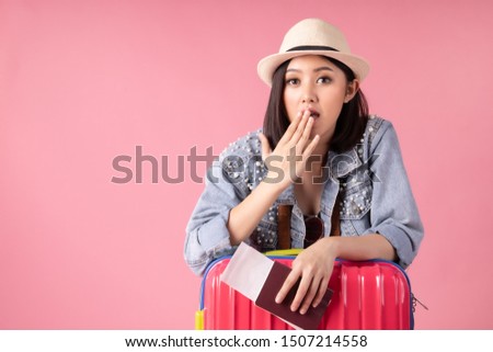 Tourist woman in summer casual clothes.Asian Smiling woman .Passenger traveling abroad to travel on pink background.Asian woman going to summer vacation.Travel trip funny.