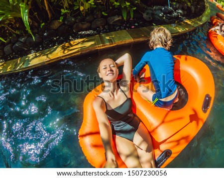 Mom and son have fun at the water park