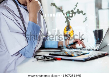 Medical Healthcare Research and Development Concept.The female doctor is sitting at desk on the background. Technological digital futuristic virtual interface,