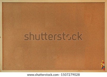 Blank cork board wooden frame texture background with pins.