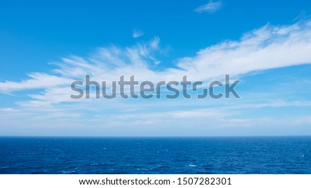 splashing waves in ocean with blue sky, life concept