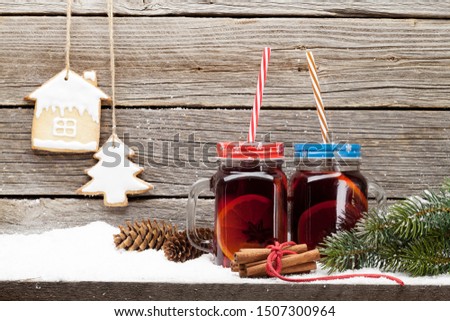 Christmas card with mulled wine hot drink, gingerbread cookies and xmas fir tree branch. View with space for your greetings