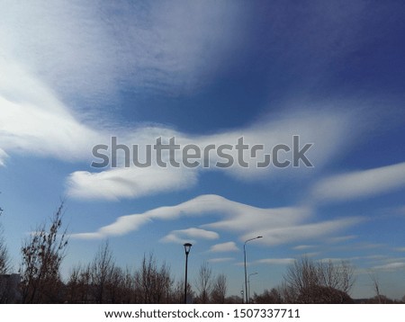 White clouds in the form of mountains on blue the sky