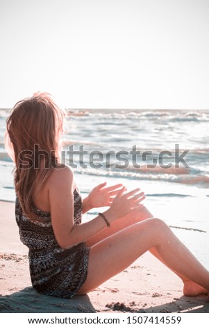 beautiful, young girl on the ocean