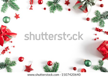 Christmas holiday composition. Xmas gifts and decorations, berries, fir tree branches on white background. Christmas, New Year, winter concept. Flat lay, top view, copy space