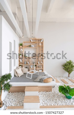 Luxury fashionable modern design studio apartment with a free layout in a minimal style. very bright huge spacious room with white walls and wooden elements. 