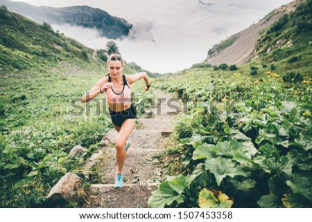 Woman running and jogging in the nature mountain scenery. Concept of healthy lifestyle. Fitness spot girl training in mountain. Royalty-Free Stock Photo #1507453358