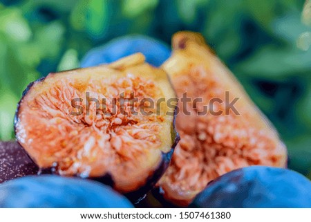 Fresh juicy figs fruit. Macro half a fig. Shallow depth of field. Toned image. Blurry background. Copy space. Soft focus. Art photography. Closeup
