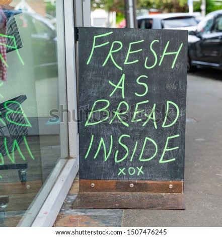 Sign outside bakery using kiwi slang