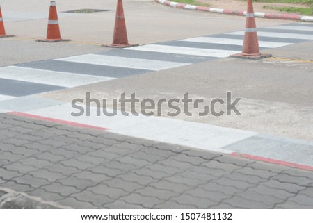 the crosswalk lines on a road concrete