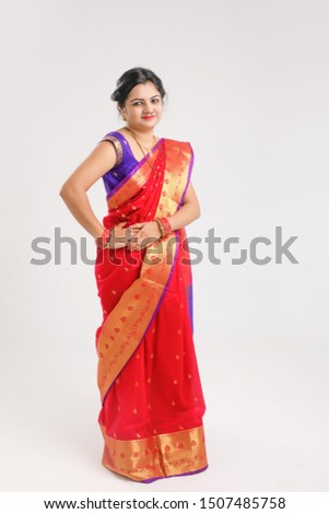 Happy Young indian woman wearing sari and Smiling 
