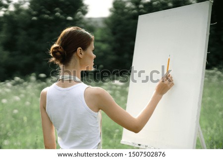 woman artist painting brush white canvas model