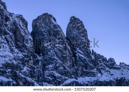 Italian Dolomites top mountain skyline detail. Gransasso in Val Gardena, Winter season snow, golden hour mountain top's picture.