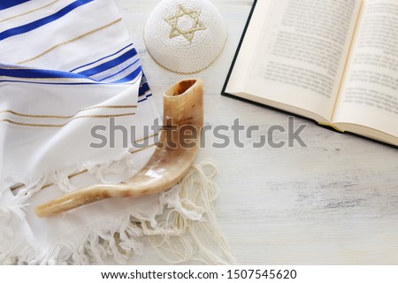 religion image of Prayer Shawl - Tallit, Prayer book and Shofar (horn) religious symbols. Rosh hashanah (jewish New Year holiday), Shabbat and Yom kippur concept. Royalty-Free Stock Photo #1507545620