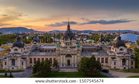 Front of the Szechenyi thermal bath in the city park of Budapest with amazing sunset lights.  Royalty-Free Stock Photo #1507545674