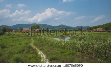 Huts at Archaeological Ruins of Liangzhu City, in Hangzhou, China Royalty-Free Stock Photo #1507565090