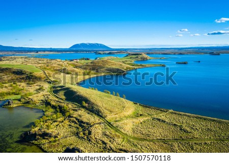 Landscape of Lake Myvatn with green pseudocraters and islands at.Popular tourist destination in north of Iceland, Europe