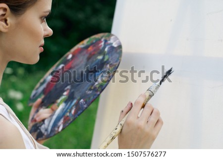 woman canvas paint artist brush