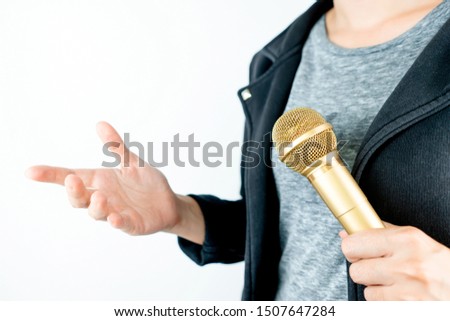 Business people holding microphone isolated on white