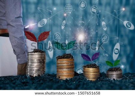 Concept of Business Finance and Save Money. Money coin stack growing. Network interface icons background. 