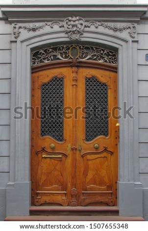 Fancy Art Neuveau Door. Wooden Door. Decorated building enterance. Fancy Door. Closed door. Royalty-Free Stock Photo #1507655348