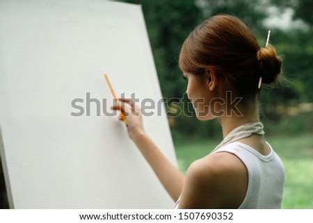 woman artist white host hand