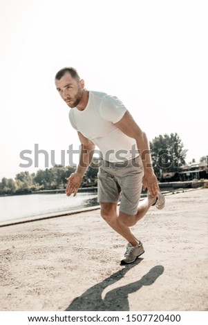A man in sportswear is training to run