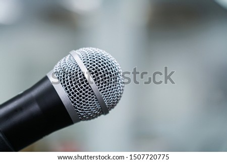 Closed up view of microphone on bokeh background.