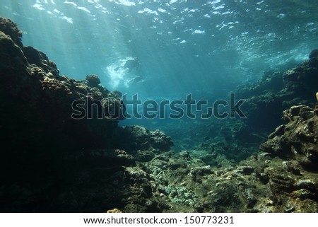Rays of sunshine over a shallow reef on Lanai, Hawaii Royalty-Free Stock Photo #150773231