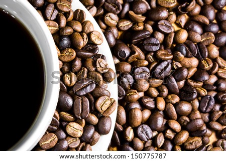 Coffee beans with a white cup