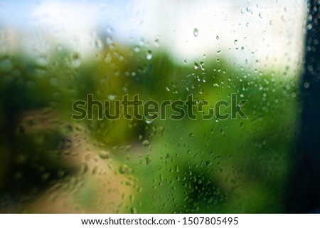 Water drops of rain on glass background.