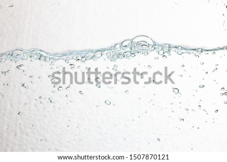Closeup bubbles underwater on white background.