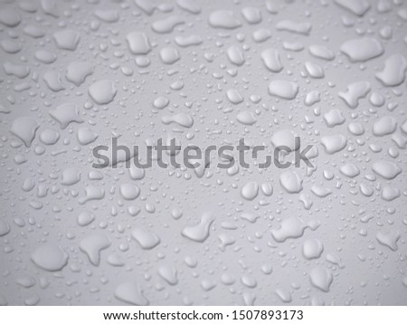 Drop of water on silver background, water droplets wet in the rainy season