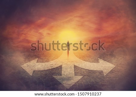 Surreal view as teenager walks in front of a crossroad with road is split in three different ways as arrows. Choosing the correct pathway between left, right and front. Difficult decision concept. Royalty-Free Stock Photo #1507910237