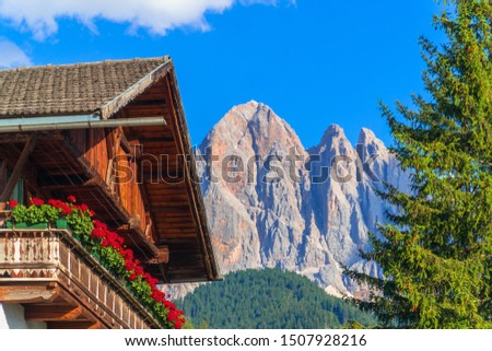 Val di Funes, South Tyrol / Italy. Traditional alpine house with the Dolomites in the background