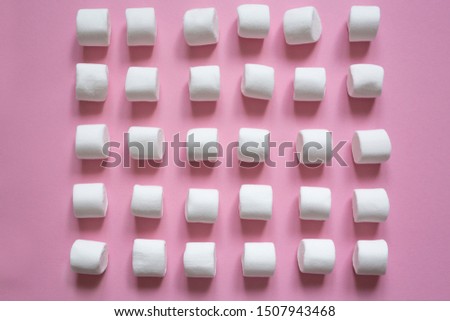 wallpaper with white marshmallows on a pink background