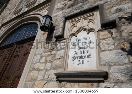 Signage on old stone church