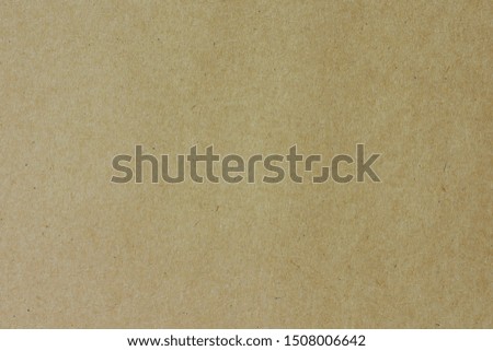 Cardboard carton craft background.
Brown paper Kraft recycle texture. 
Grunge old paper card light and shadow.
top view.