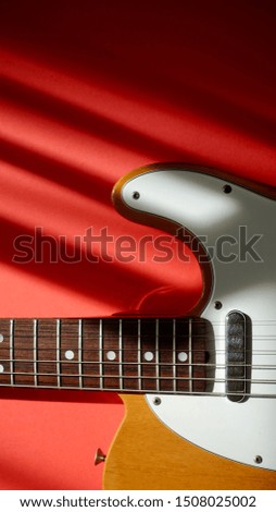 electric guitar in the sunlight . color background
