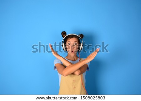 denial signs woman in headphones on a blue background