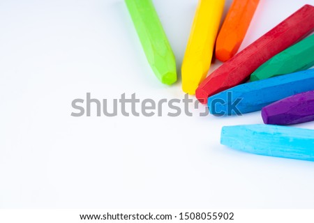 colorful crayons on white background
