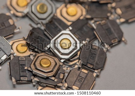 Pile of Tiny Surface Mount Tactile Buttons for electronic products (Macro)  