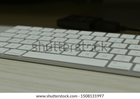 Modern keyboard close up view with shallow depth field shot and dark background. High resolution image