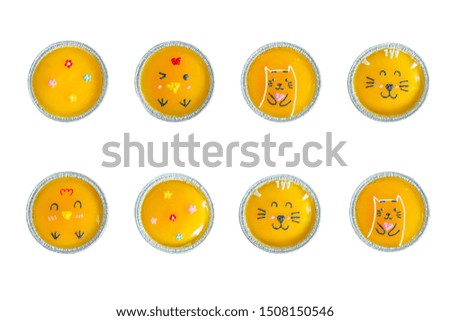 Top view minimal orange cake with butter cream in foil cup isolated on white background.