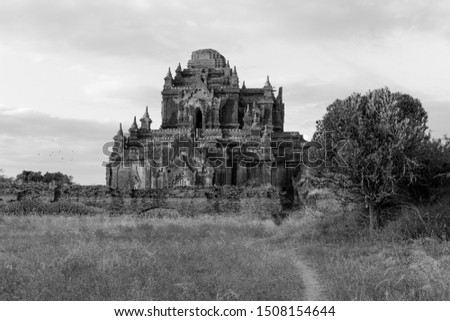 Black and white picture of the ruins of Thitsarwadi Temple during sunset time in Bagan, Myanmar