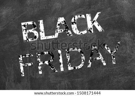 Black Friday written on black chalkboard